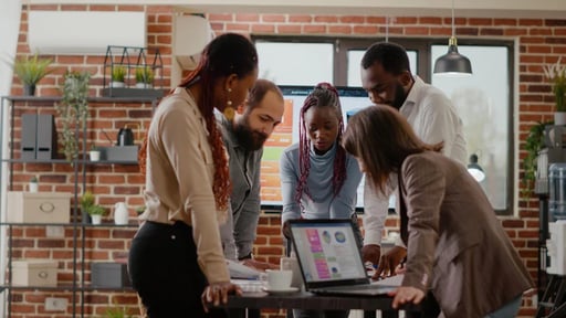 A person using a laptop to research digital marketing techniques for startups